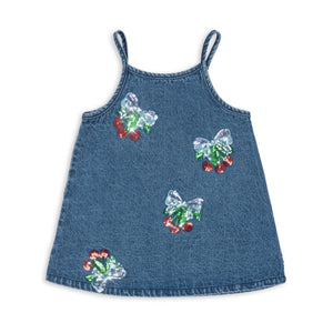 Denim dress with butterfly and flower patterns on a white background