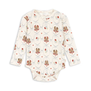 Floral-patterned baby onesie on a white background
