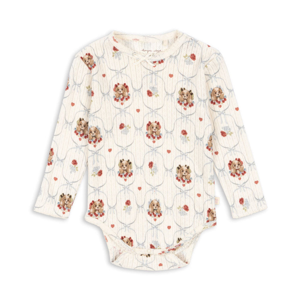 Floral-patterned baby onesie on a white background