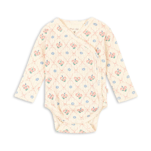 Baby bodysuit with floral pattern on a white background