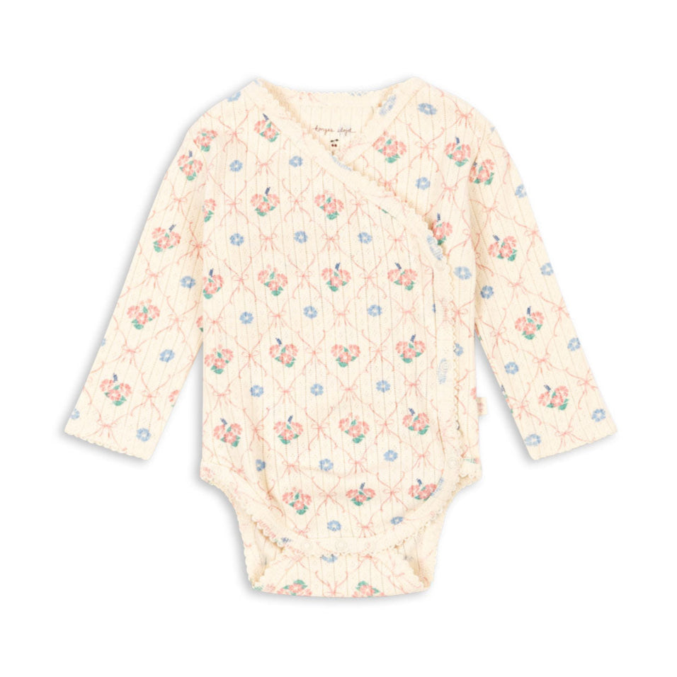 Baby bodysuit with floral pattern on a white background