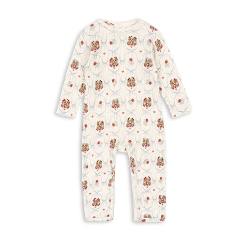 Floral patterned baby onesie on a white background