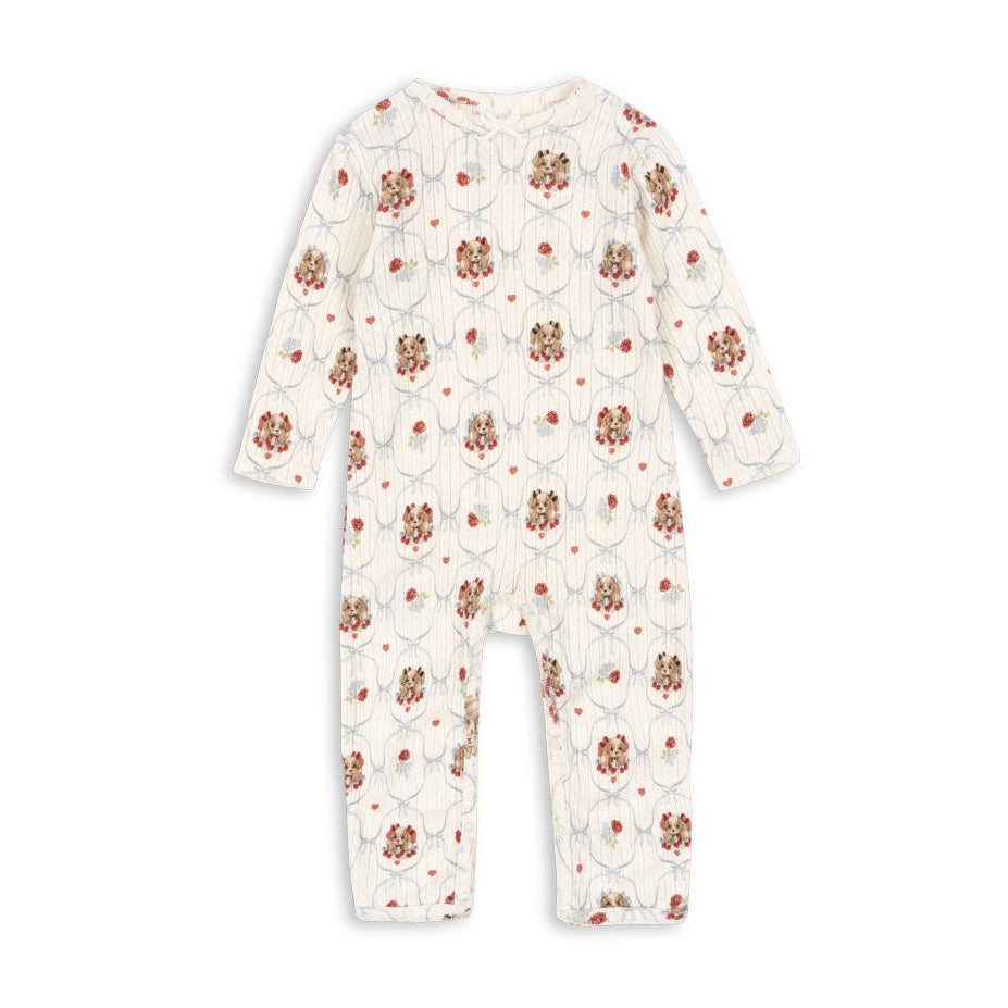Floral patterned baby onesie on a white background