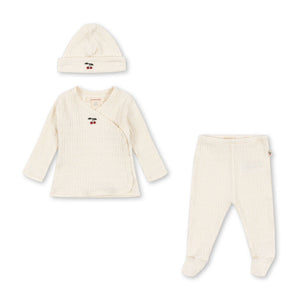 Baby outfit set with long-sleeve shirt, pants, and hat on a white background
