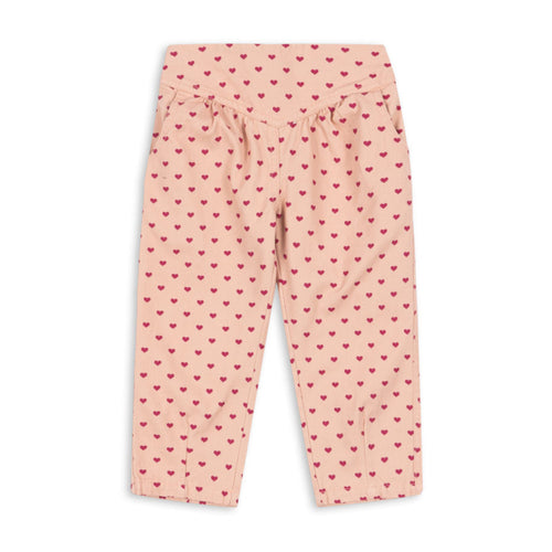 Pink pants with red heart pattern on a white background