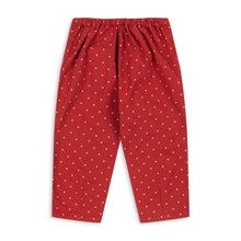 Load image into Gallery viewer, Red pants with white polka dots on a white background