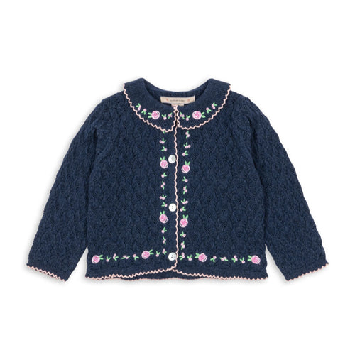 Navy blue cardigan with floral embroidery on a white background