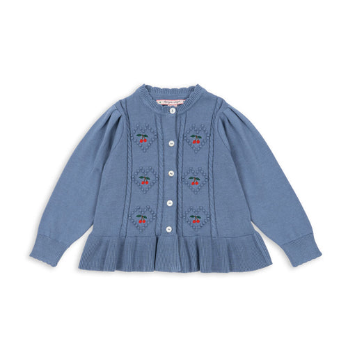 Blue cardigan with floral patterns on a white background