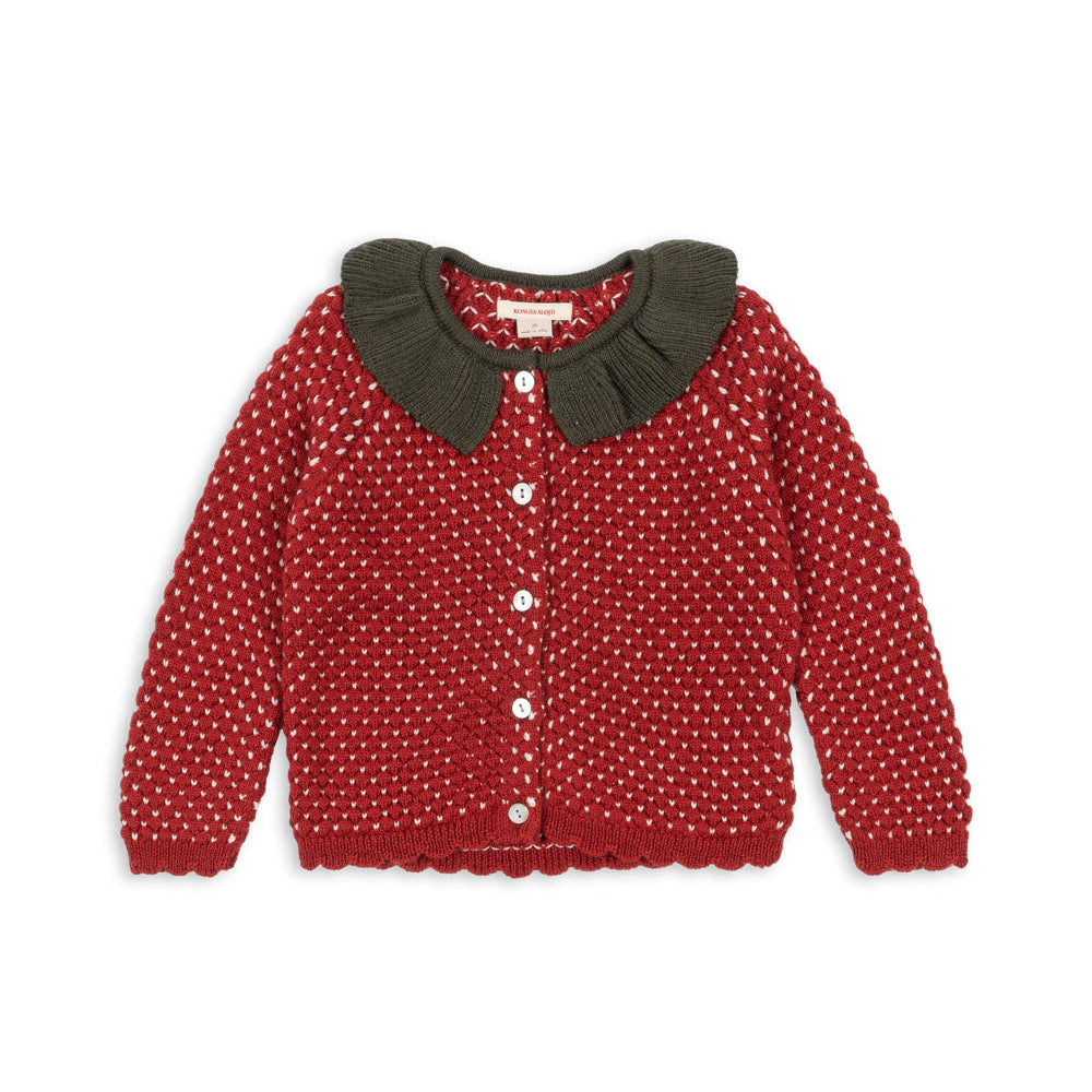 Red polka dot cardigan with a brown collar on a white background