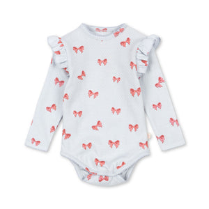 Baby bodysuit with ruffled sleeves and red bow pattern on a white background