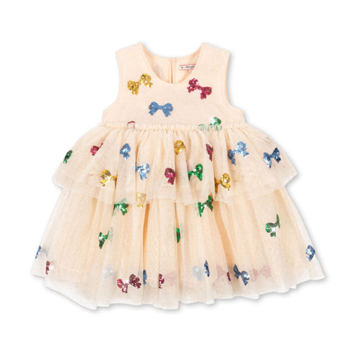 Beige dress with colorful butterfly and bow patterns on a white background