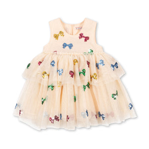 Beige dress with colorful butterfly and bow patterns on a white background