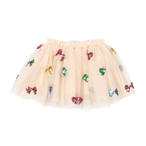 Beige tulle skirt with colorful bow decorations on a white background
