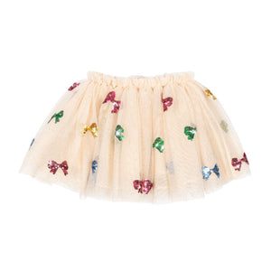 Beige tulle skirt with colorful bow decorations on a white background