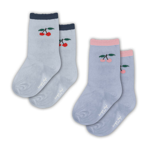 Two pairs of light blue socks with cherry designs on a white background