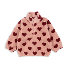 Load image into Gallery viewer, Pink fleece jacket with red heart patterns on a white background