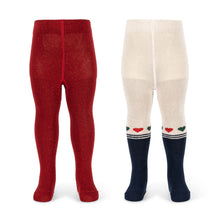 Load image into Gallery viewer, Red tights on the left and white tights with navy stripes and heart patterns on the right, on a white background.