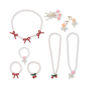 Set of hair accessories including hair ties and clips on a white background