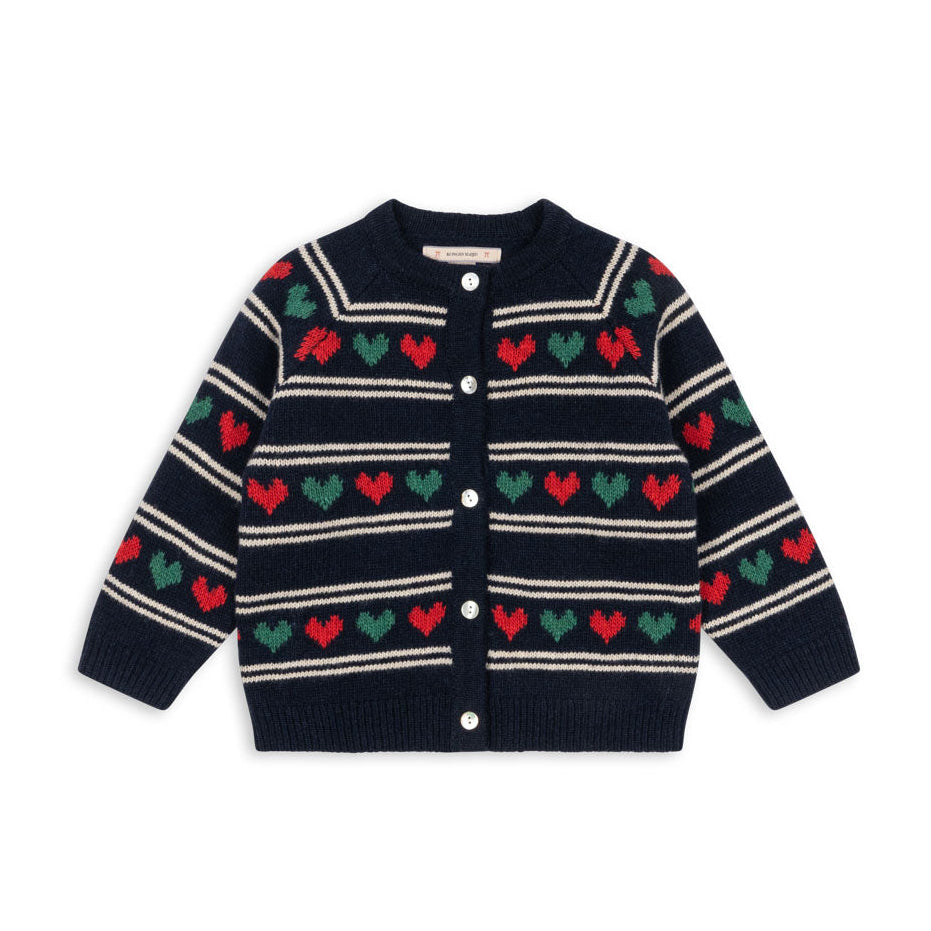Navy cardigan with red and green heart patterns on a white background