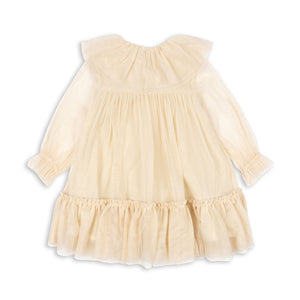 Beige dress with ruffled details on a white background