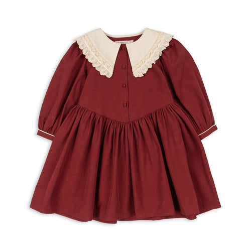 Red dress with white collar on a white background