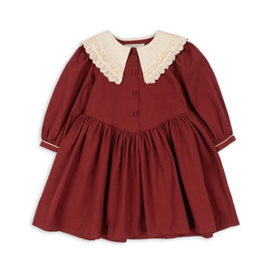 Red dress with white collar on a white background