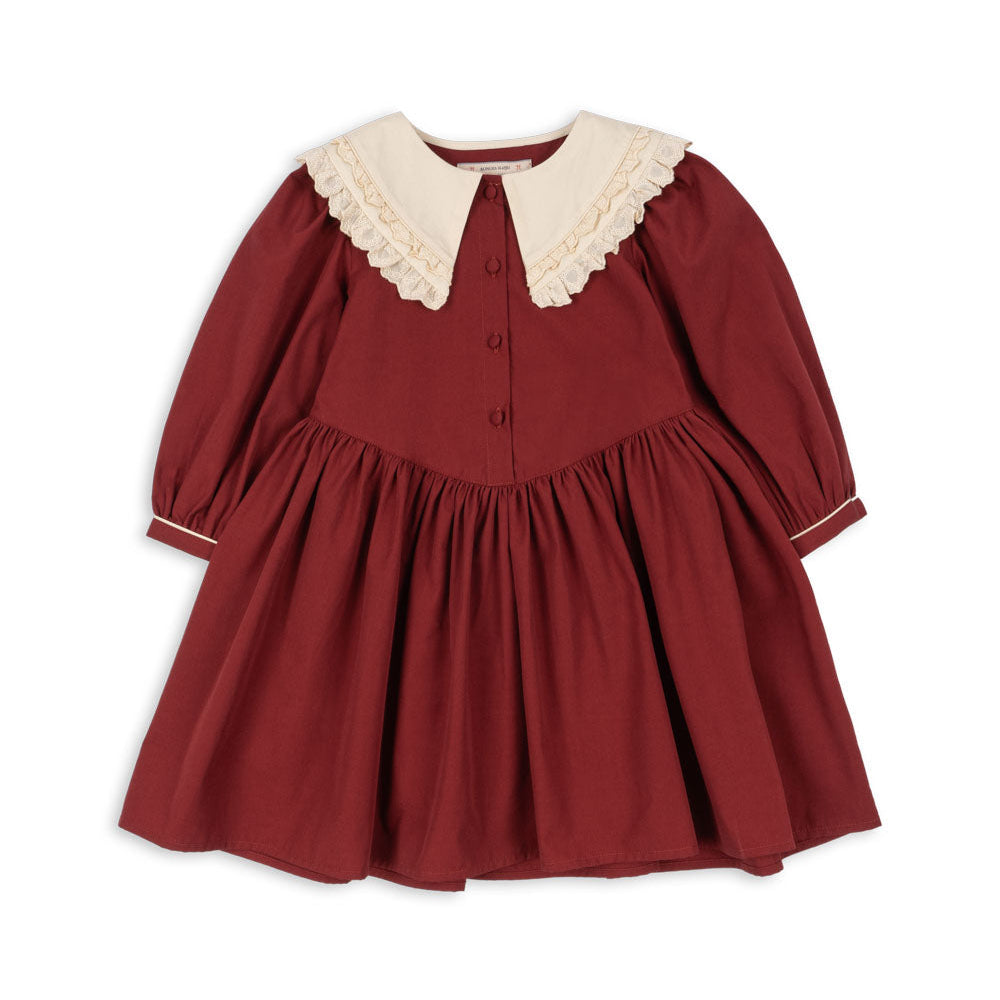 Red dress with white collar on a white background