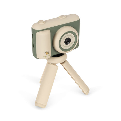 Toy camera with a tripod on a white background