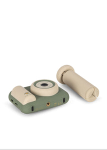 Toy camera with roll of film on a white background