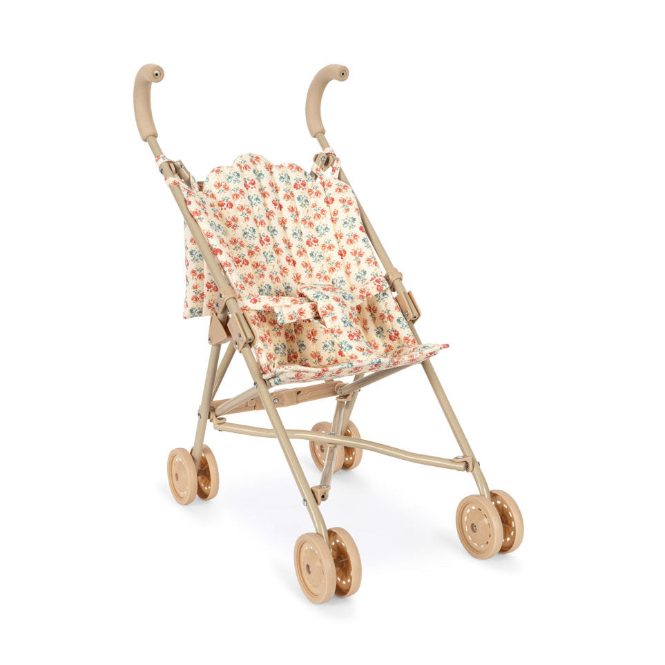 Miniature floral stroller on a white background