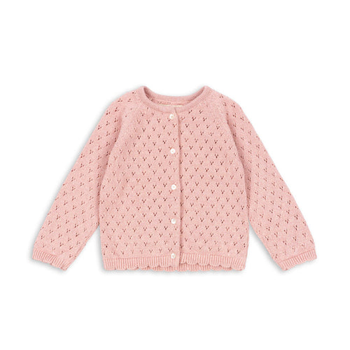 Pink textured cardigan on a white background