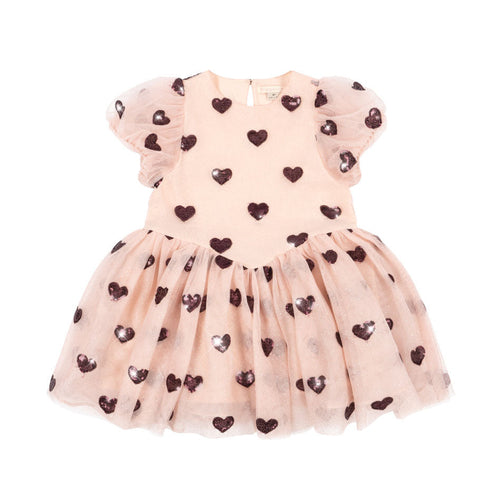 Pink dress with heart patterns on a white background