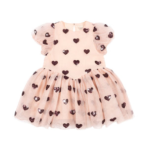 Pink dress with heart patterns on a white background