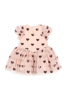 Pink dress with heart patterns on a white background
