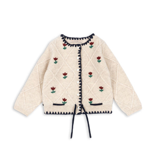 Cream-colored quilted jacket with floral embroidery on a white background