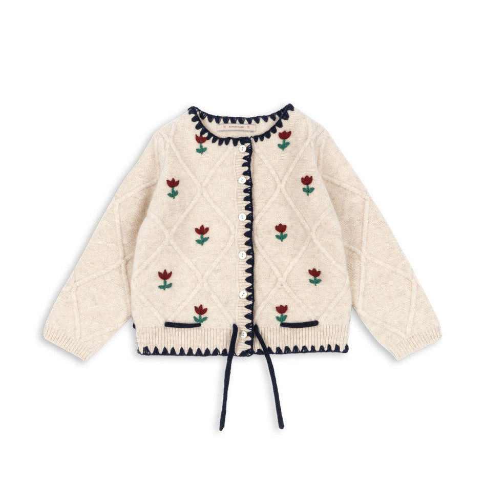 Cream-colored quilted jacket with floral embroidery on a white background