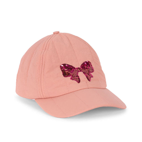 Pink baseball cap with a decorative bow on a white background