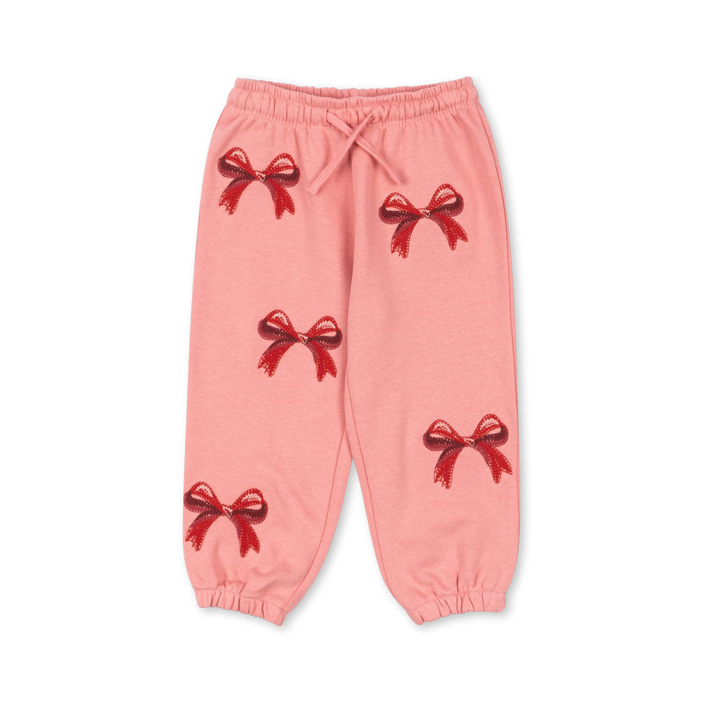 Pink pants with red bow designs on a white background