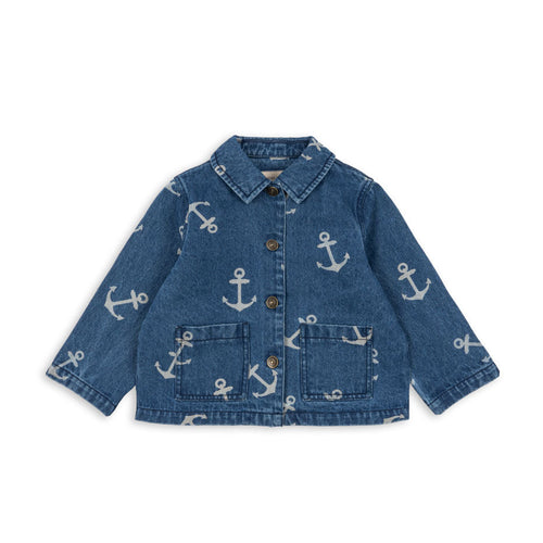 Blue denim jacket with anchor pattern on a white background