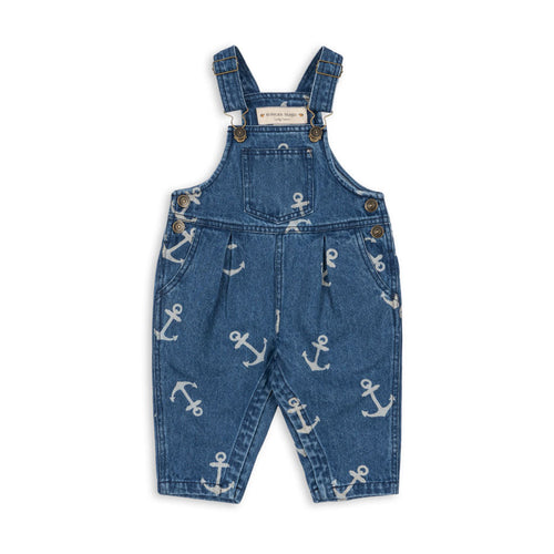 Blue denim overalls with anchor pattern on a white background