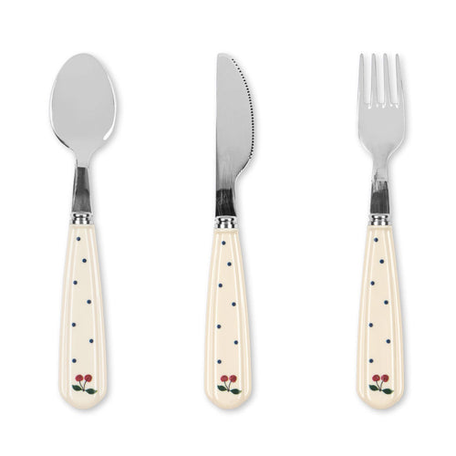 Set of three cutlery items with polka dot handles on a white background