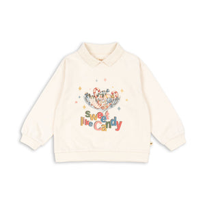 Beige sweatshirt with colorful text and graphics on a white background