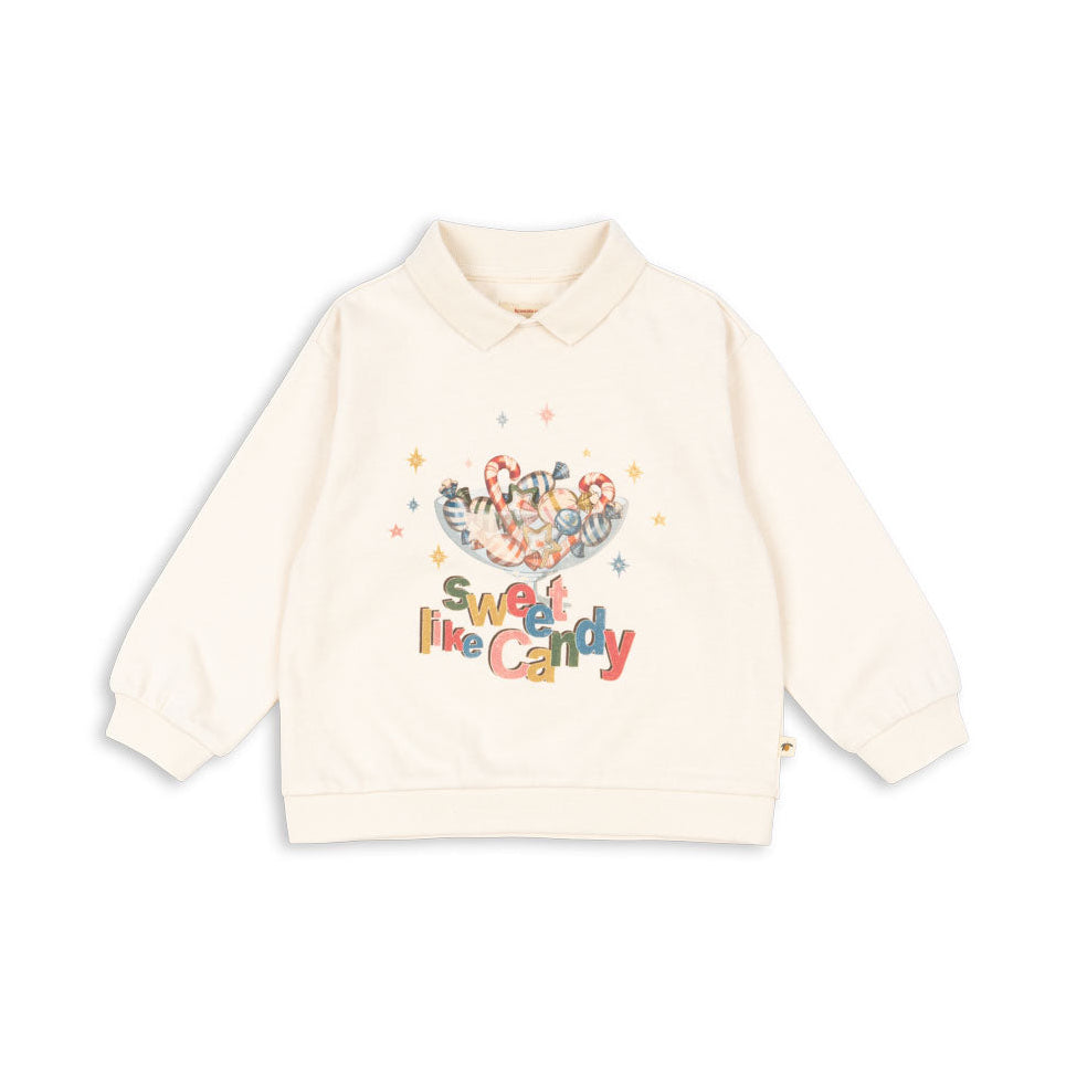 Beige sweatshirt with colorful text and graphics on a white background