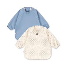 將圖片載入圖庫檢視器 Two baby bibs, one blue and one with a pattern, on a white background