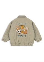 Load image into Gallery viewer, Beige jacket with sports-themed design and 'In it to Win It' text on a white background