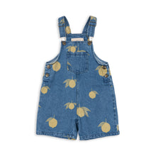 Load image into Gallery viewer, Blue denim overalls with lemon pattern on a white background