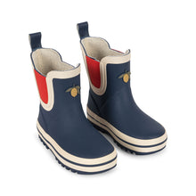將圖片載入圖庫檢視器 Pair of navy blue rain boots with red and beige accents on a white background