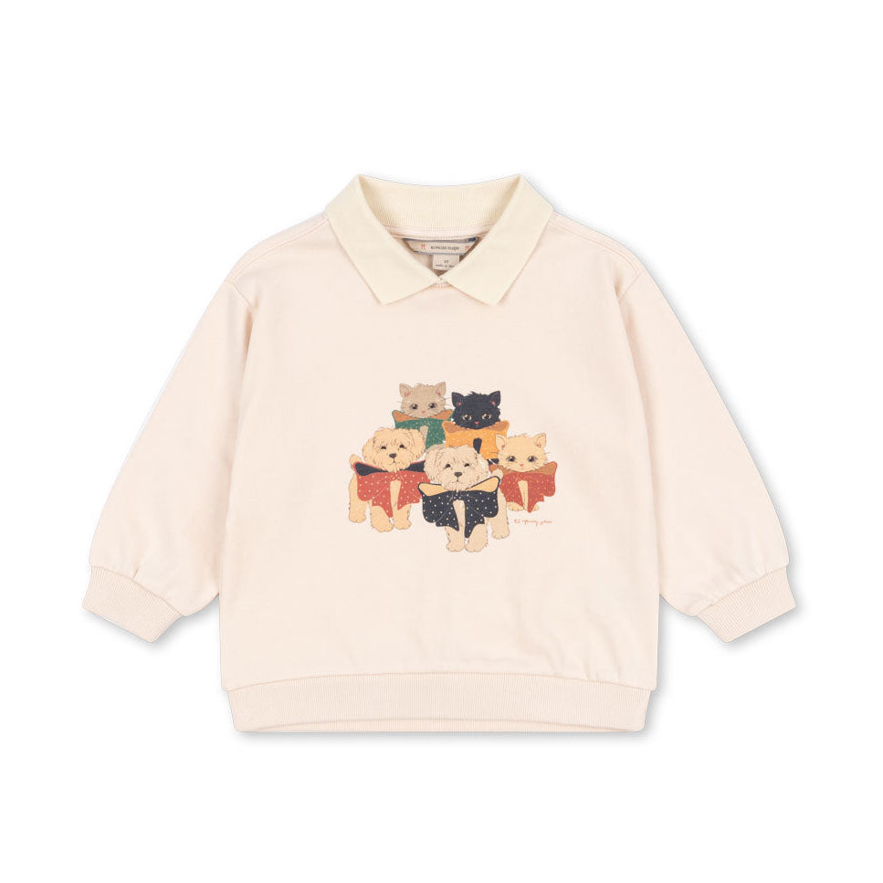 Beige sweater with cat design on a white background