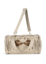 Load image into Gallery viewer, Beige duffel bag with brown bear design on a white background