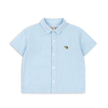將圖片載入圖庫檢視器 Light blue shirt with a small embroidered design on a white background